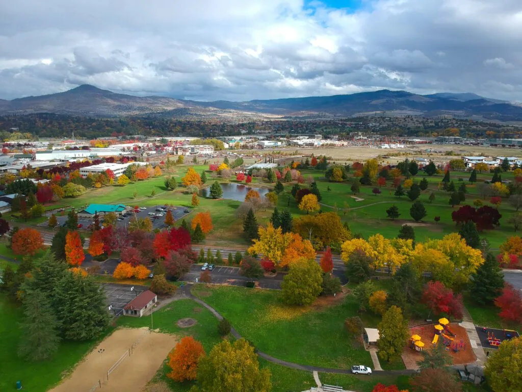 Park and rooftops below Roxy Ann Peak in Medford